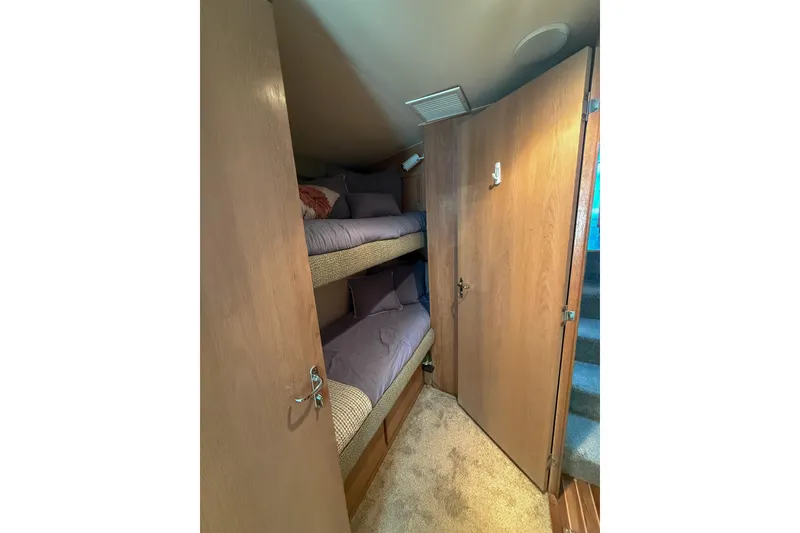 Slide: The Image of Interior of 1995 Hatteras 54 Convertible yacht with cozy bunk beds. - 32