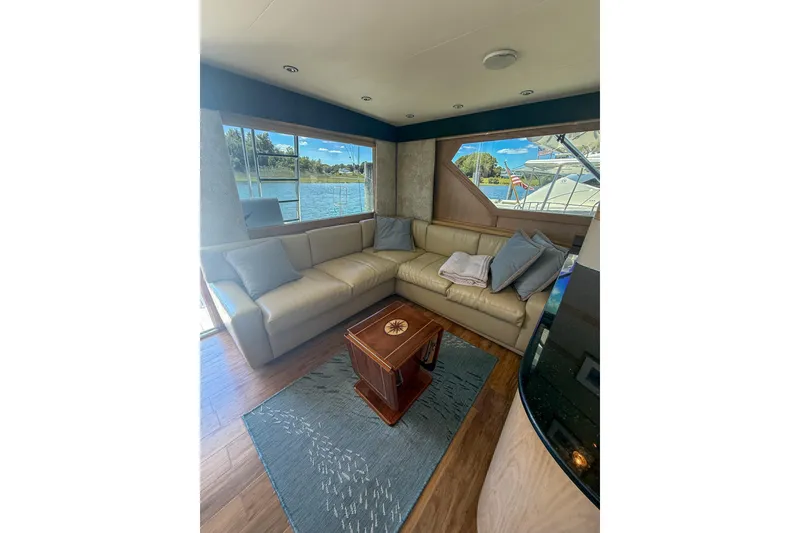 Slide: The Image of Luxurious interior of 1995 Hatteras 54 Convertible yacht with comfortable seating and scenic views. - 45