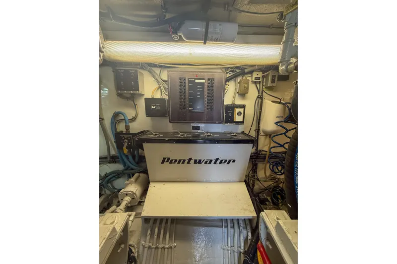 Slide: The Image of Engine room of 1995 Hatteras 54 Convertible yacht with Pentwater equipment. - 58