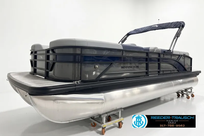 Slide: The Image of 2027 Bennington 23 SLJ pontoon boat with sleek design in showroom setting. - 3