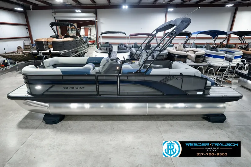The Image of 2027 Bennington 23 SLJ pontoon boat in showroom, featuring sleek design and modern amenities. - 0