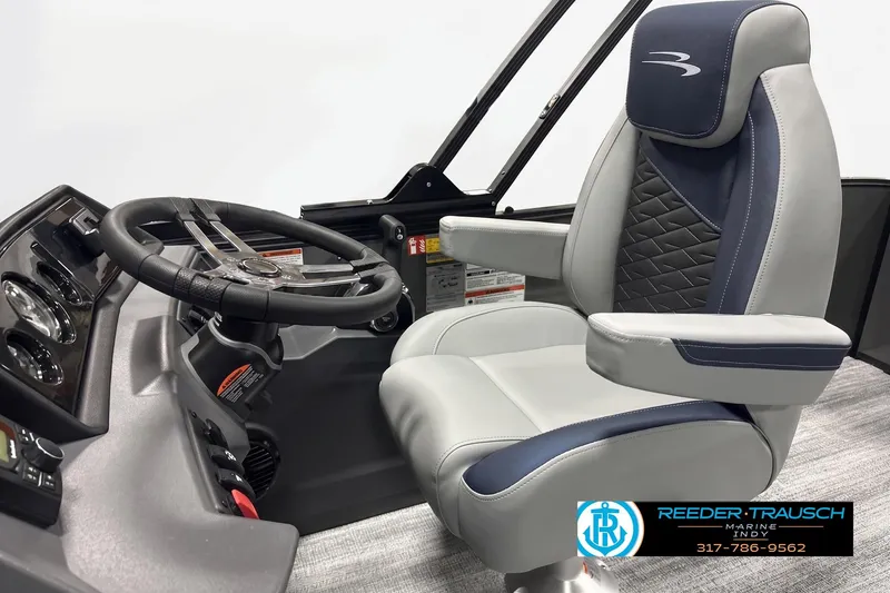 Slide: The Image of 2027 Bennington 23 SLJ boat interior with steering wheel and captain's chair. - 4