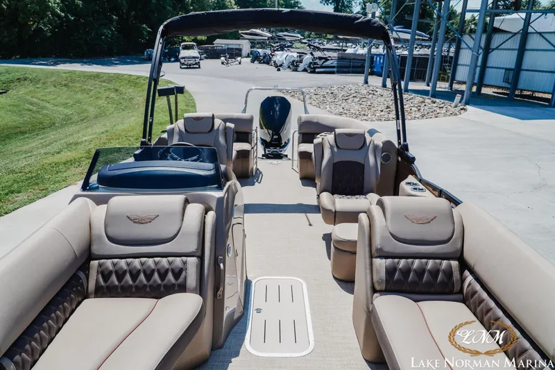 Slide: The Image of 2024 Bennington 24LXSFB pontoon boat with luxurious seating at Lake Norman Marina. - 15