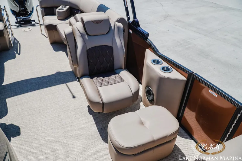 Slide: The Image of 2024 Bennington 24LXSFB pontoon boat interior with luxurious seating and cup holders. - 20