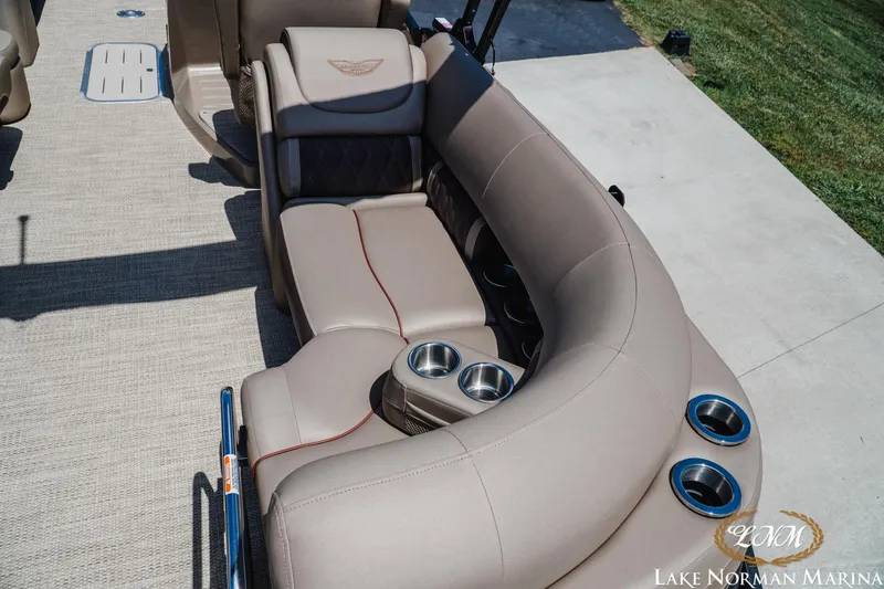 Slide: The Image of Luxurious seating on 2024 Bennington 24LXSFB boat with cup holders, beige upholstery. - 8