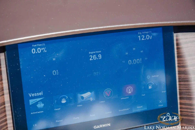 Slide: The Image of Garmin display on 2024 Bennington 24LXSFB showing engine data and settings. - 23