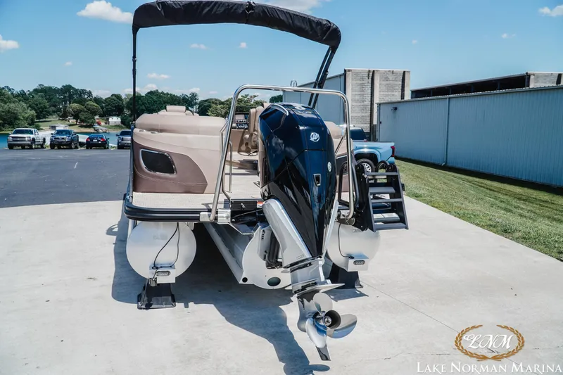 Slide: The Image of 2024 Bennington 24LXSFB pontoon boat with outboard motor at Lake Norman Marina. - 5