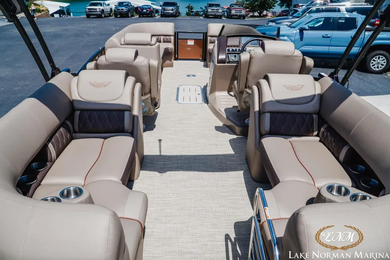 Slide: The Image of 2024 Bennington 24LXSFB pontoon boat interior with luxurious seating at Lake Norman Marina. - 6