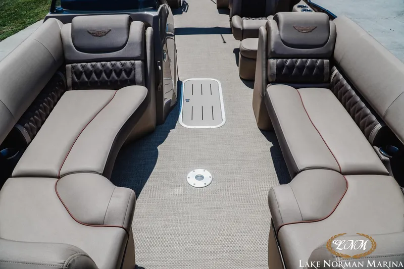 Slide: The Image of 2024 Bennington 24LXSFB pontoon boat interior with luxurious seating at Lake Norman Marina. - 16