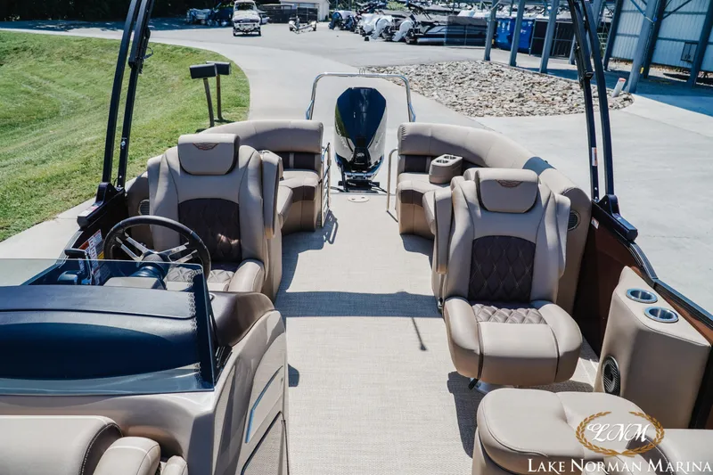 Slide: The Image of 2024 Bennington 24LXSFB pontoon boat interior with luxurious seating at Lake Norman Marina. - 19