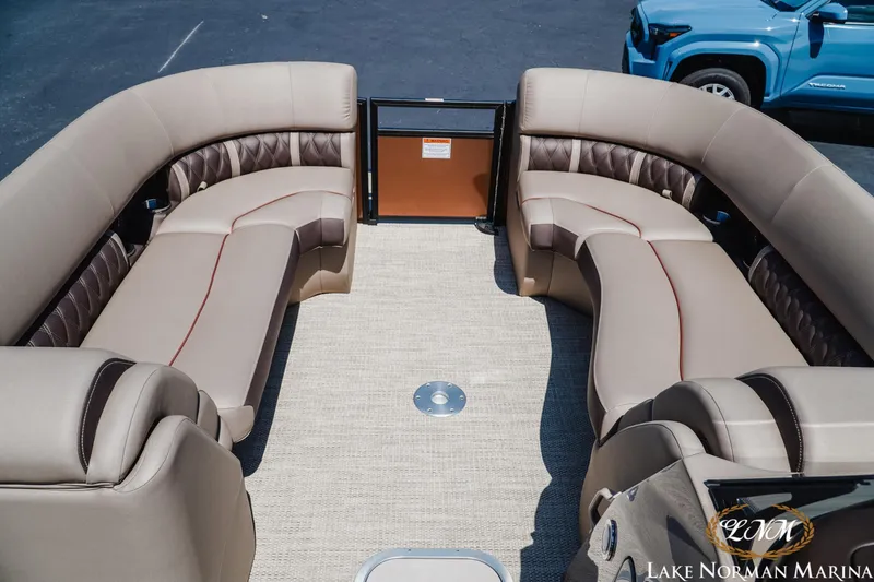 Slide: The Image of 2024 Bennington 24LXSFB pontoon boat interior with luxurious seating at Lake Norman Marina. - 14