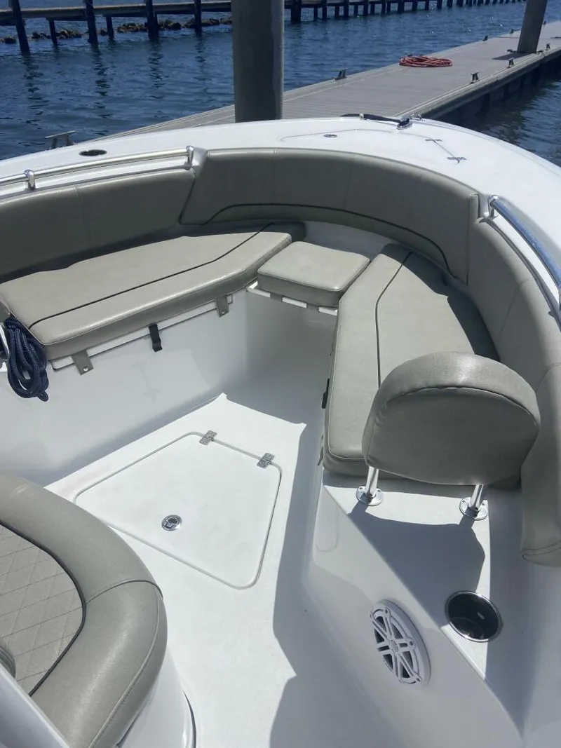 Slide: The Image of 2022 Sportsman Open 232 Center Console boat interior with cushioned seating. - 14