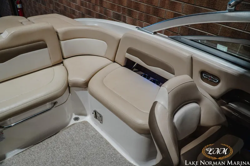 Slide: The Image of Interior of 2011 Chaparral 246 SSi boat with beige seating at Lake Norman Marina. - 17
