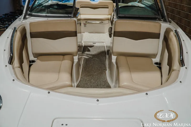 Slide: The Image of Interior view of 2011 Chaparral 246 SSi boat with beige seating at Lake Norman Marina. - 5