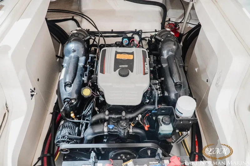 Slide: The Image of Engine compartment of a 2011 Chaparral 246 SSi boat, featuring a powerful 350 engine. - 19