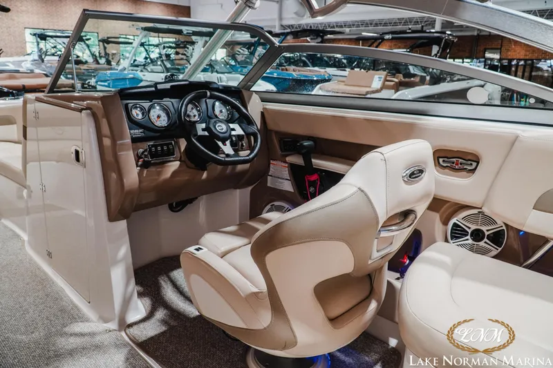 Slide: The Image of 2011 Chaparral 246 SSi boat interior with steering wheel and dashboard at Lake Norman Marina. - 11