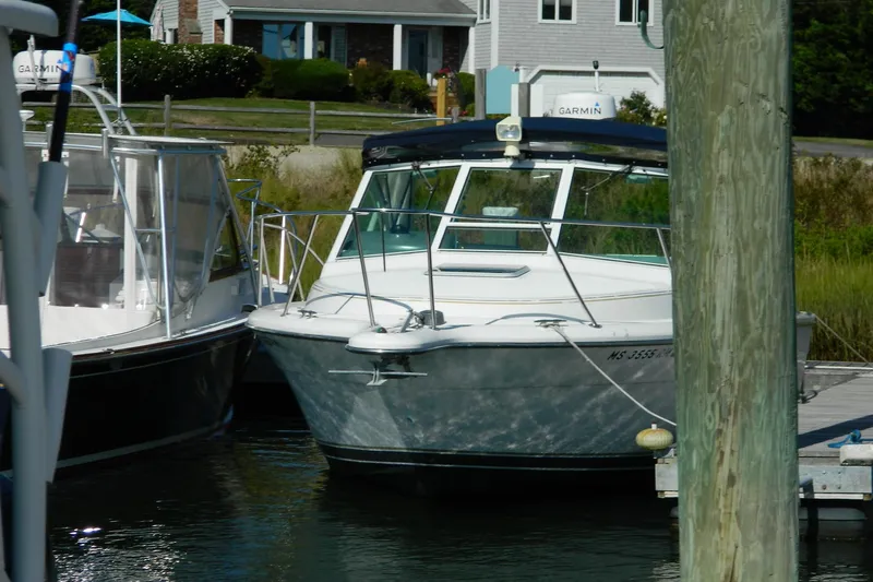 Slide: The Image of 1999 Tiara Yachts 2900 Coronet docked at marina, front view. - 1