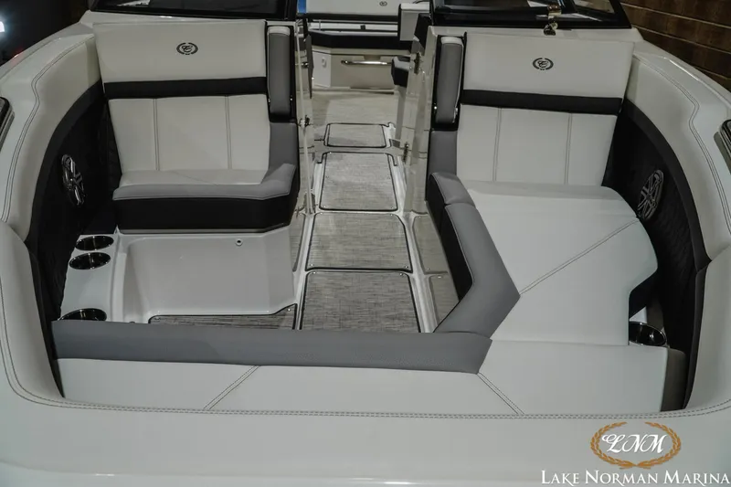 Slide: The Image of 2024 Cobalt R8 boat interior with luxurious seating and cup holders at Lake Norman Marina. - 5