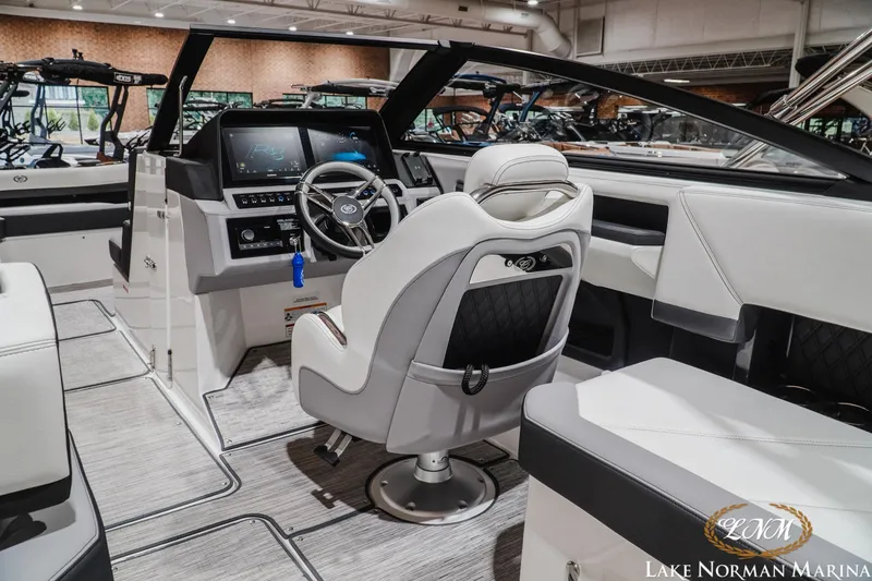 Slide: The Image of 2024 Cobalt R8 boat interior with modern dashboard and luxurious seating at Lake Norman Marina. - 12