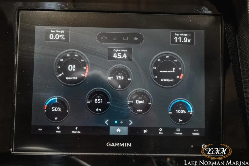 Slide: The Image of Garmin display showing engine metrics on 2024 Cobalt R8 boat dashboard. - 24
