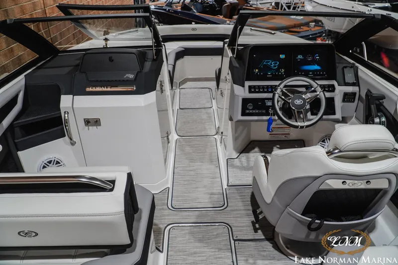 Slide: The Image of 2024 Cobalt R8 boat interior with modern dashboard and luxurious seating at Lake Norman Marina. - 15