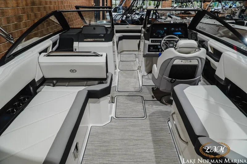 Slide: The Image of 2024 Cobalt R8 boat interior with luxurious seating and modern dashboard at Lake Norman Marina. - 10