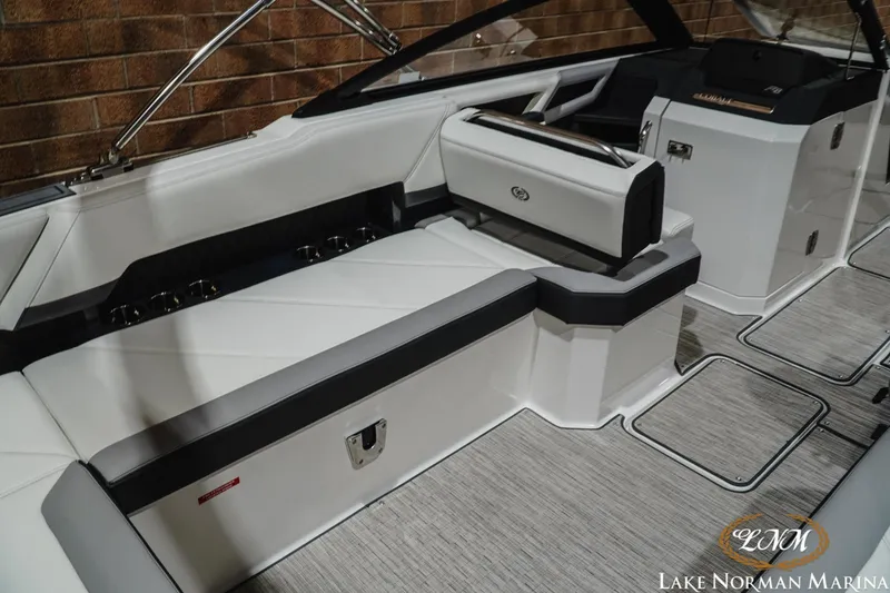 Slide: The Image of 2024 Cobalt R8 boat interior with sleek white seating and modern design at Lake Norman Marina. - 14