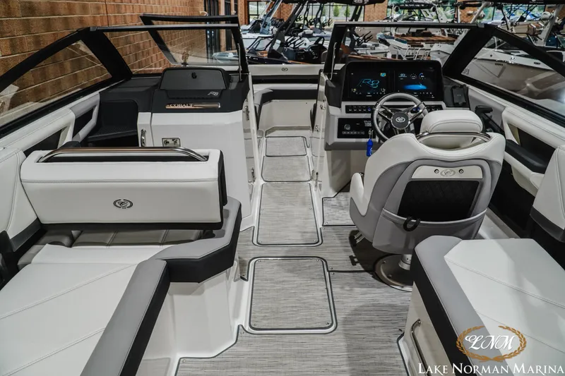 Slide: The Image of 2024 Cobalt R8 boat interior with luxurious seating and modern dashboard at Lake Norman Marina. - 11
