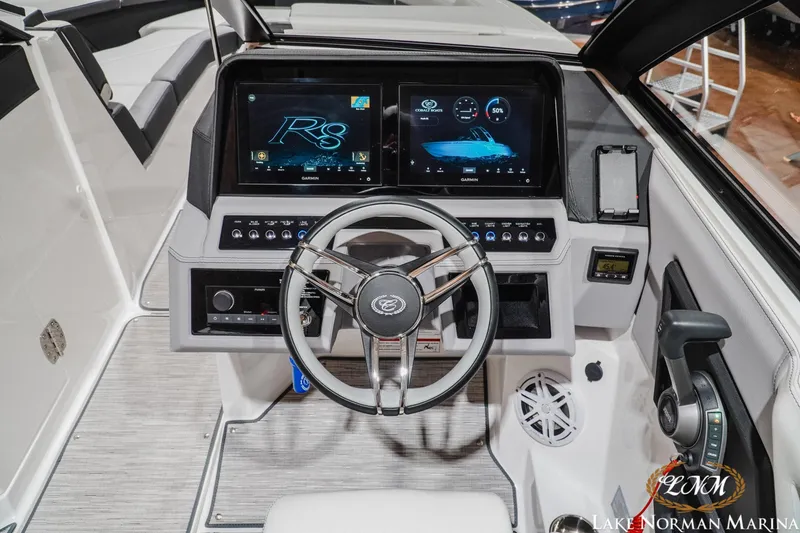 Slide: The Image of 2024 Cobalt R8 boat dashboard with advanced controls and dual Garmin displays. - 17