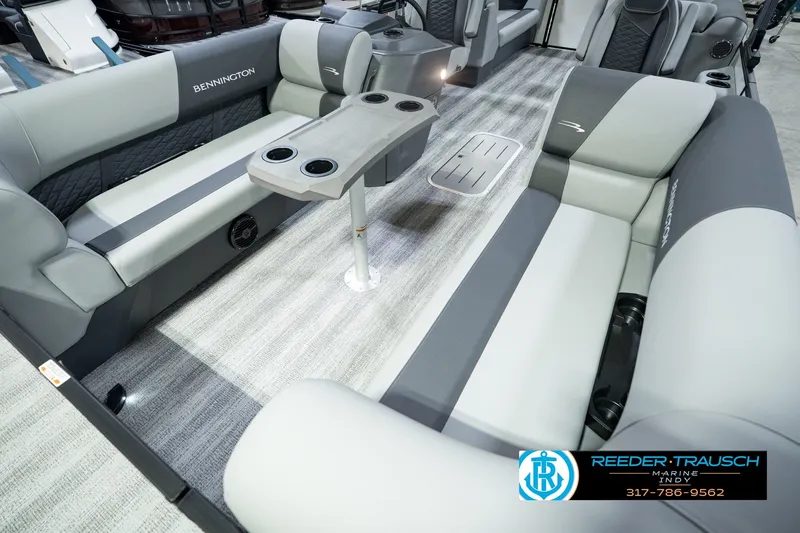 Slide: The Image of 2027 Bennington 22 SSR pontoon boat interior with gray seating and cup holders. - 13