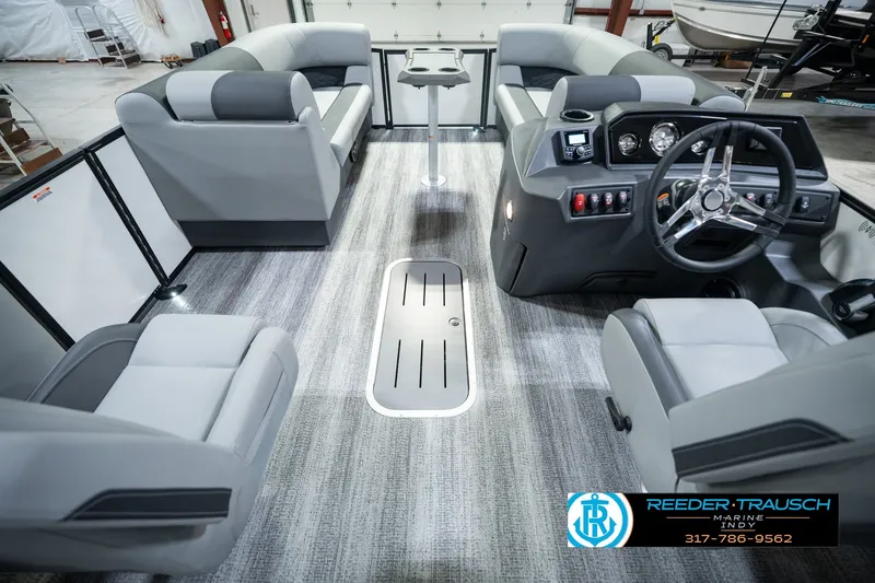 Slide: The Image of 2027 Bennington 22 SSR pontoon boat interior with modern seating and steering console. - 24