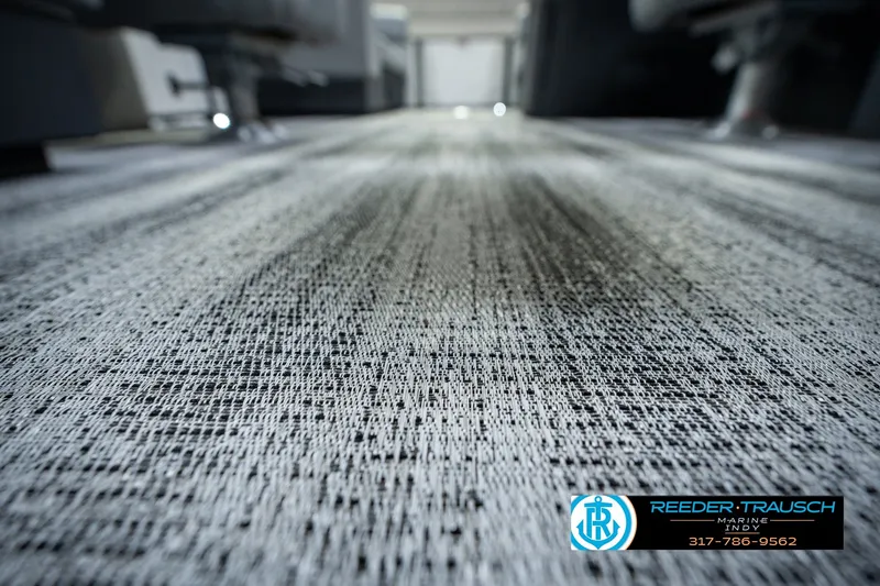 Slide: The Image of Carpet texture inside a 2027 Bennington 22 SSR boat, featuring Reeder-Trausch Marine branding. - 55