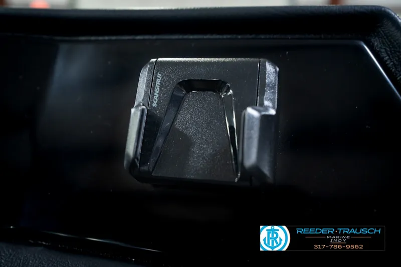 Slide: The Image of Close-up of a 2027 Bennington 22 SSR boat component with Reeder-Trausch Marine branding. - 44