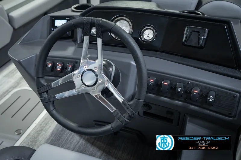 Slide: The Image of Steering console of 2027 Bennington 22 SSR boat with modern controls and gauges. - 36