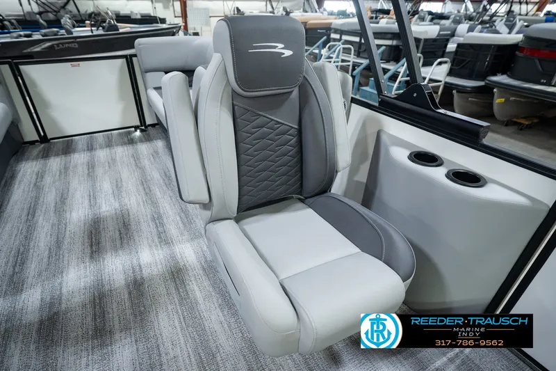 Slide: The Image of 2027 Bennington 22 SSR boat interior with gray seating and cup holders. - 32
