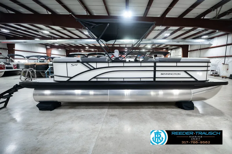 Slide: The Image of 2027 Bennington 22 SSR pontoon boat in showroom, side view with canopy. - 6