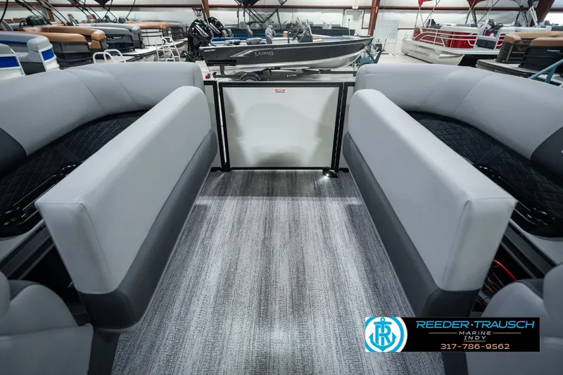 Slide: The Image of 2027 Bennington 22 SSR pontoon boat interior with gray seating and carpet flooring. - 35
