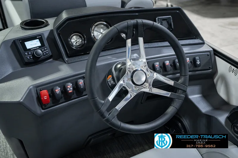 Slide: The Image of 2027 Bennington 22 SSR boat dashboard with steering wheel and control panel. - 37