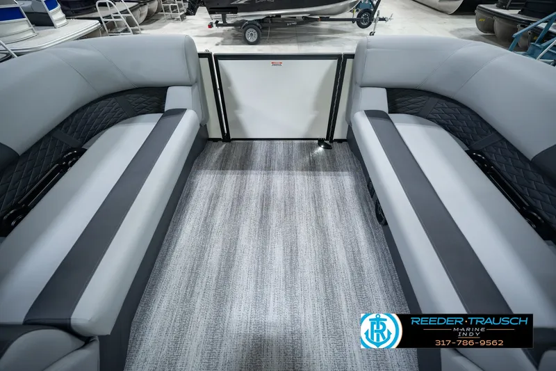 Slide: The Image of Interior of a 2027 Bennington 22 SSR pontoon boat with gray seating and carpet. - 21