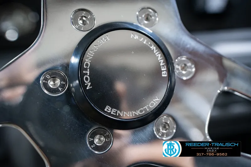 Slide: The Image of Close-up of 2027 Bennington 22 SSR steering wheel with logo and bolts. - 38