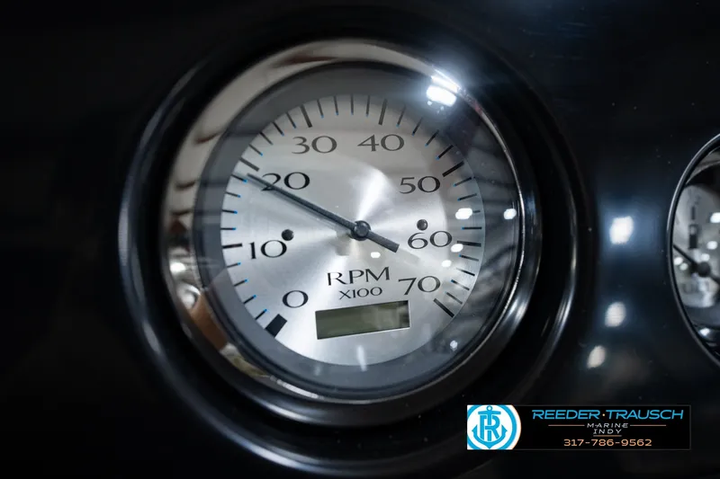 Slide: The Image of Close-up of a 2027 Bennington 22 SSR RPM gauge, displaying up to 70 x100 RPM. - 42