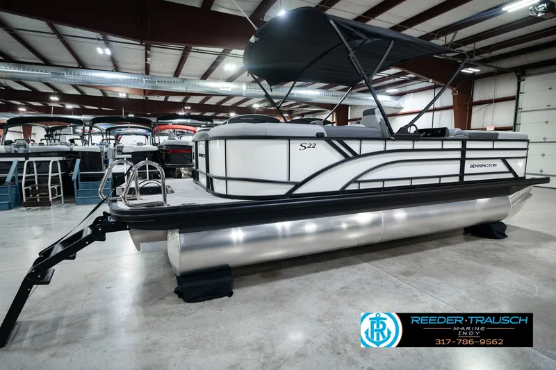 Slide: The Image of 2027 Bennington 22 SSR pontoon boat in showroom with canopy and sleek design. - 8