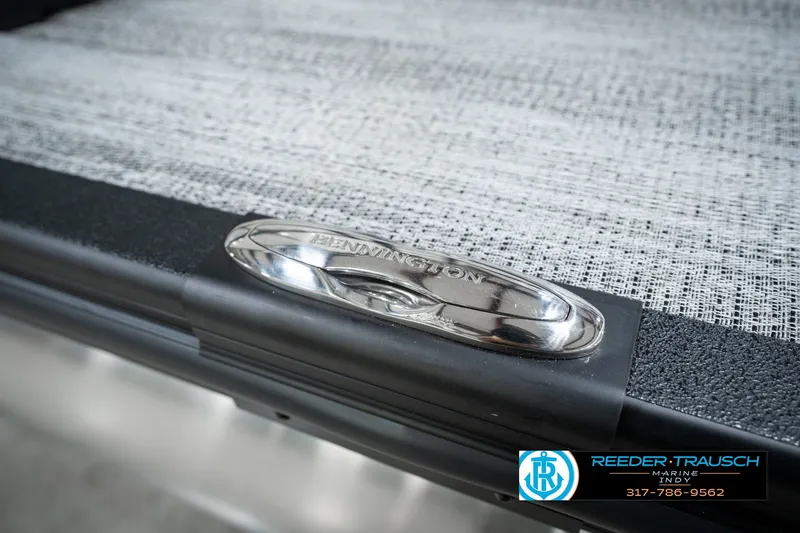 Slide: The Image of 2027 Bennington 22 SSR boat detail with logo and textured surface. - 60
