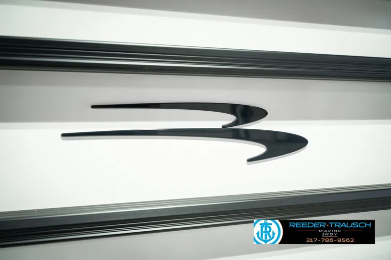 Slide: The Image of 2027 Bennington 22 SSR logo with sleek black design on a white background. - 56