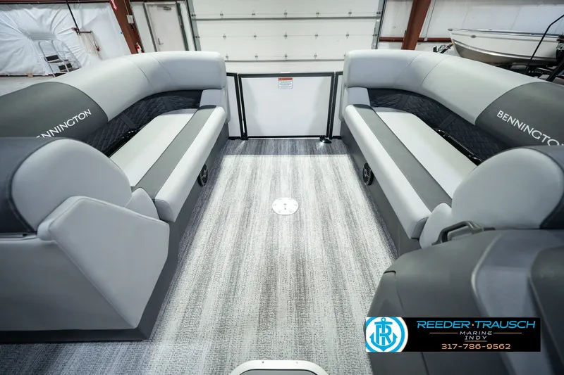 Slide: The Image of 2027 Bennington 22 SSR pontoon boat interior with gray seating and carpeted flooring. - 26