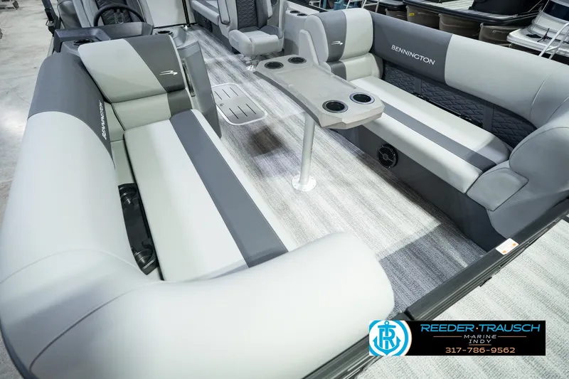 Slide: The Image of 2027 Bennington 22 SSR pontoon boat interior with gray seating and cup holders. - 15
