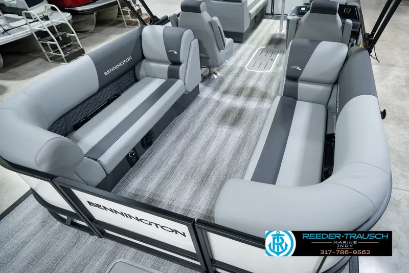 Slide: The Image of 2027 Bennington 22 SSR pontoon boat with spacious gray seating and modern interior design. - 17