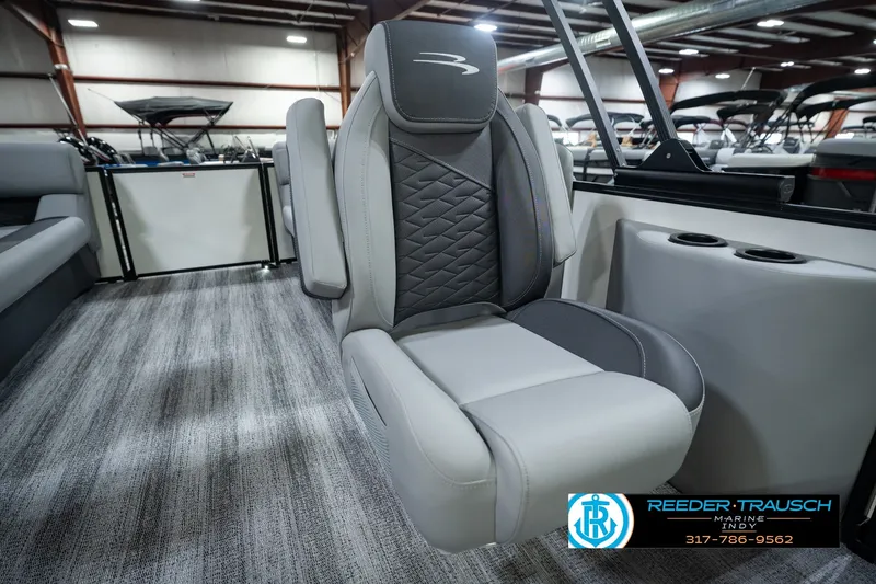 Slide: The Image of Luxury seating on a 2027 Bennington 22 SSR pontoon boat in showroom. - 51