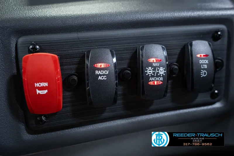 Slide: The Image of Control panel of a 2027 Bennington 22 SSR boat with labeled switches. - 39