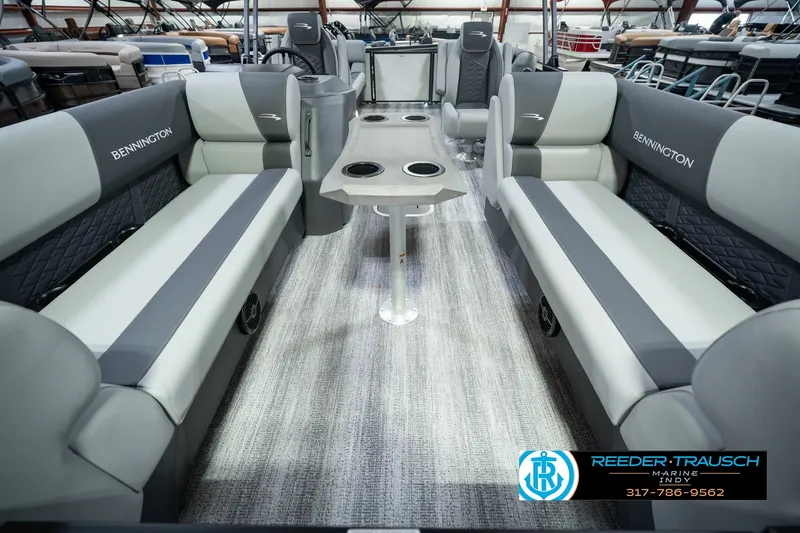 Slide: The Image of 2027 Bennington 22 SSR pontoon boat interior with gray seating and central table. - 14